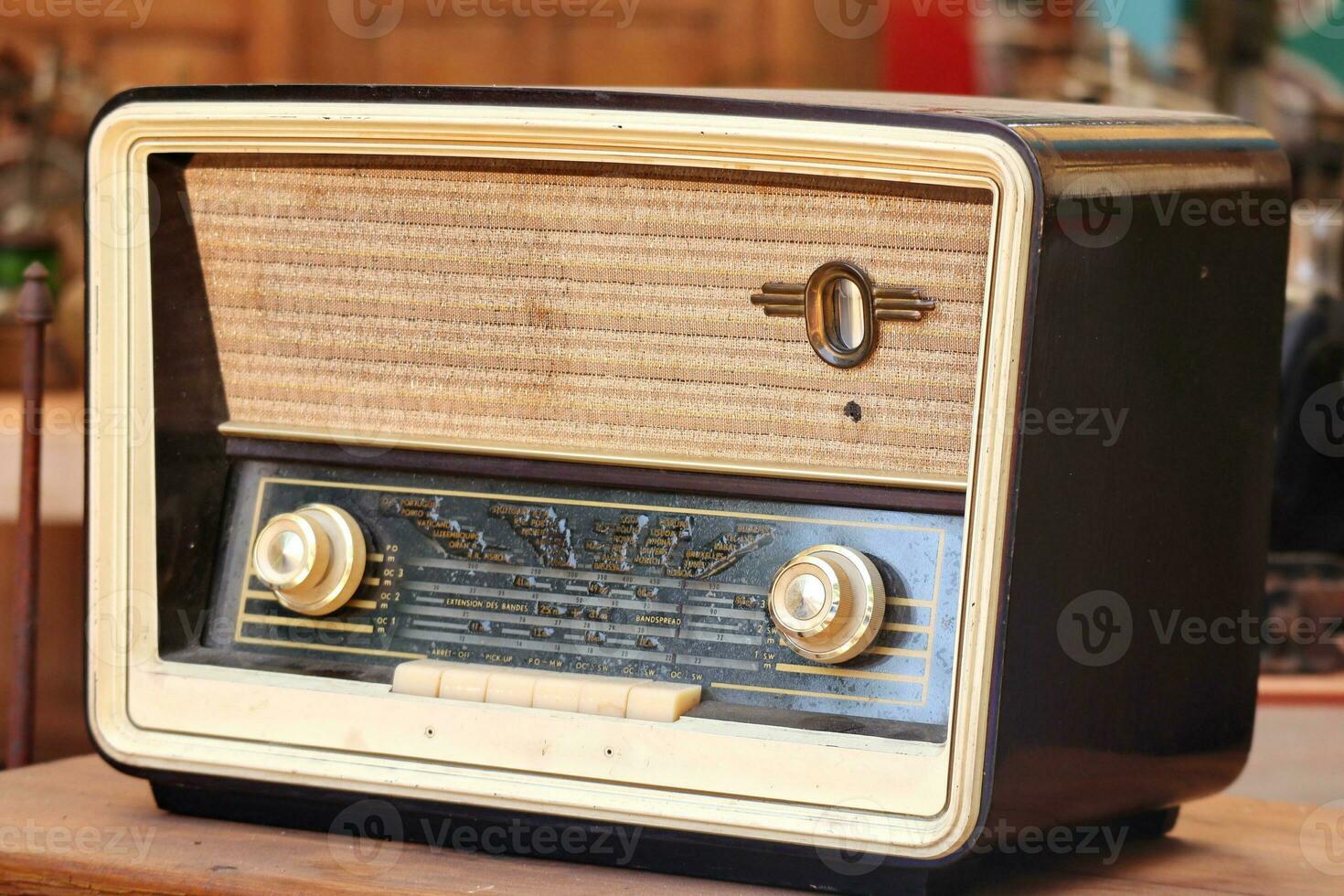 Retro broadcast radio receiver on wooden table circa 1950 photo