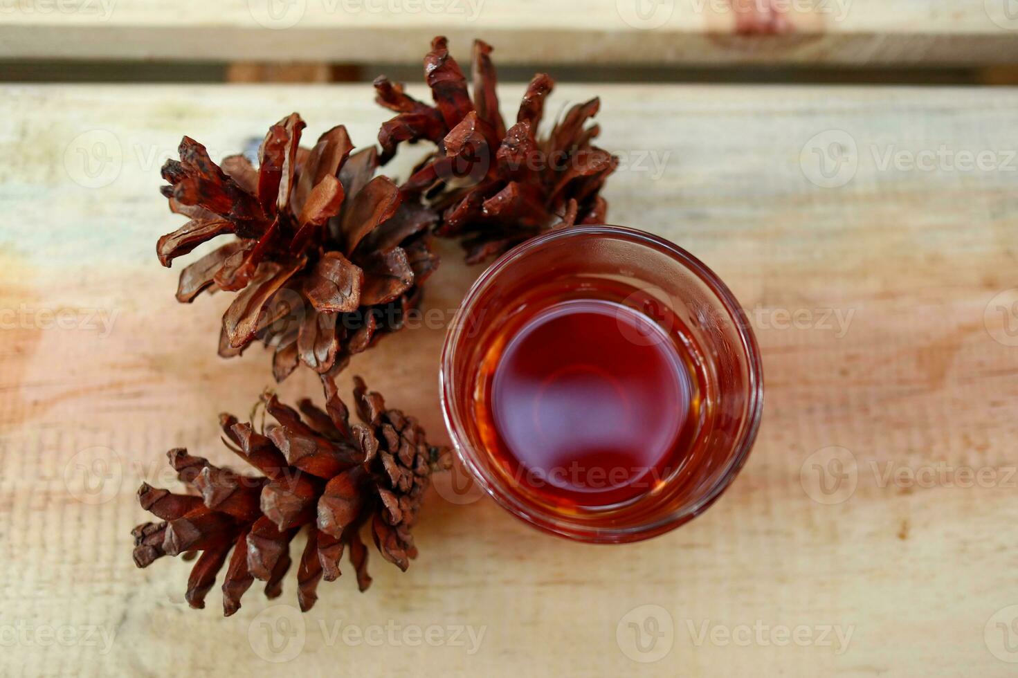 brewing coffee in a glass on a wooden table photo