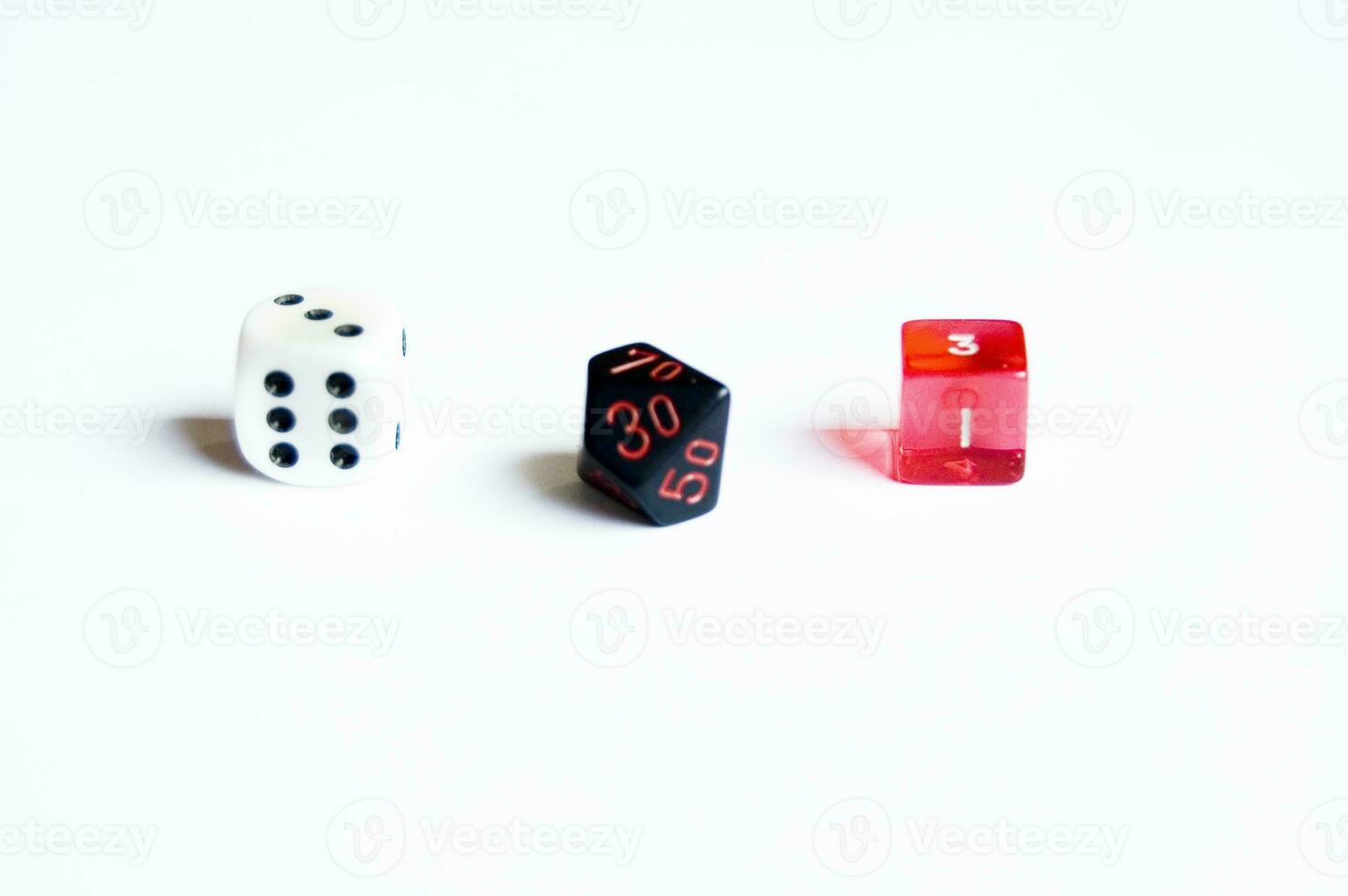 various dice lying on a white isolated background photo