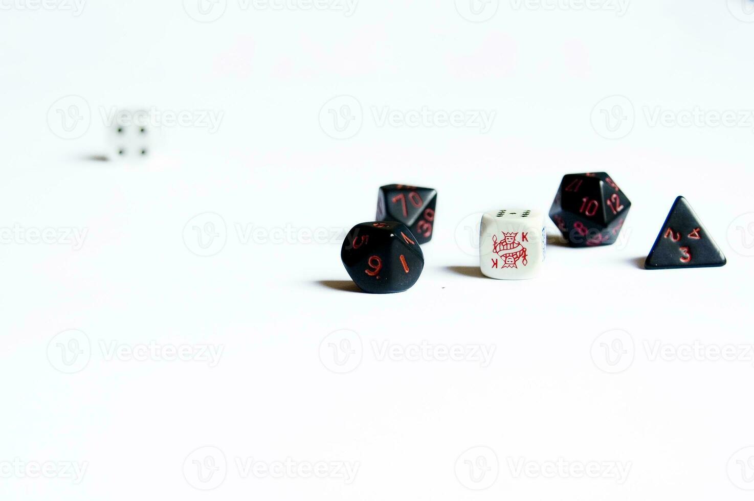 various dice lying on a white isolated background photo