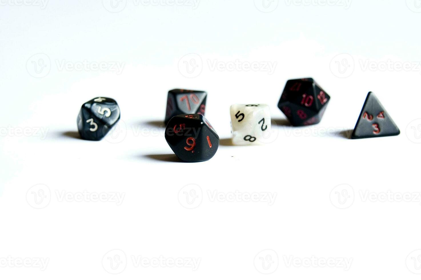 various dice lying on a white isolated background photo