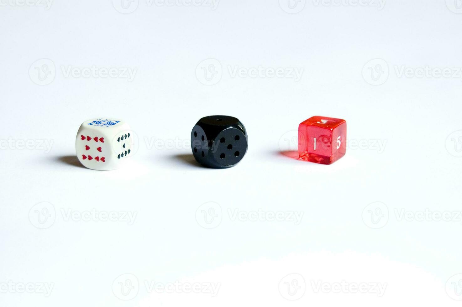 various dice lying on a white isolated background photo