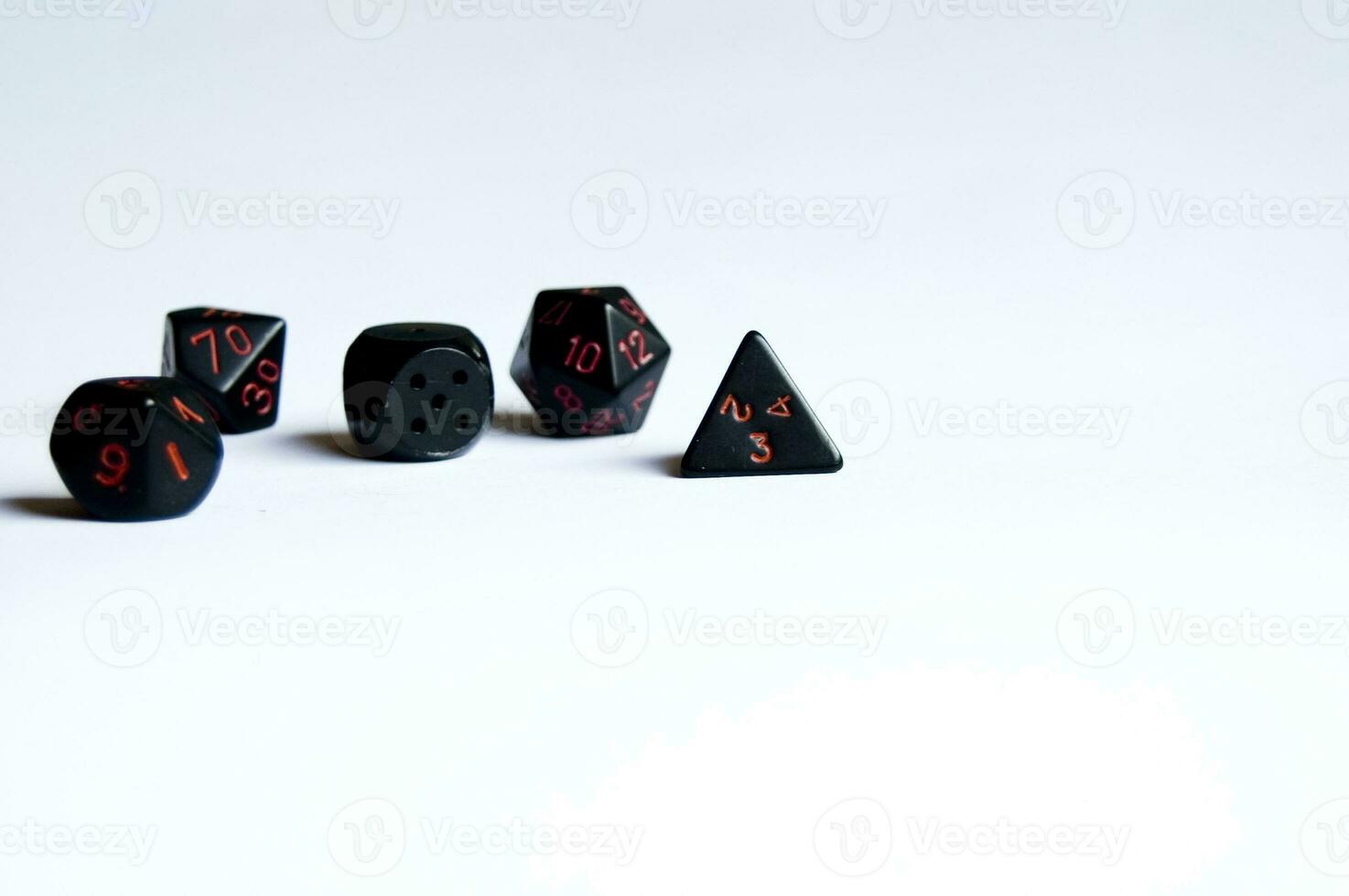 various dice lying on a white isolated background photo