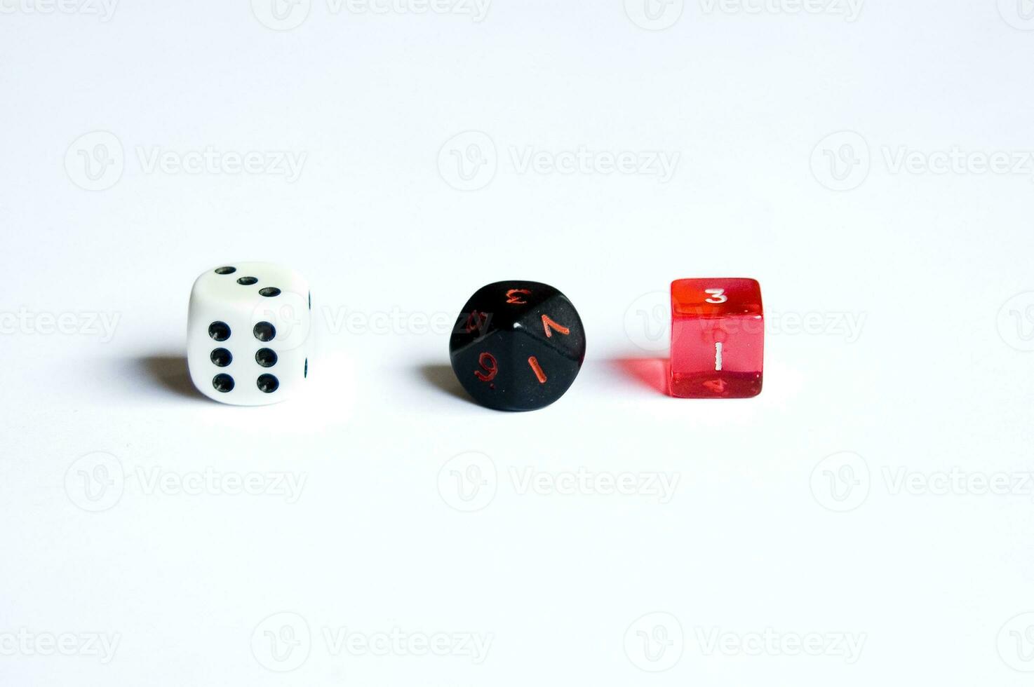 various dice lying on a white isolated background photo