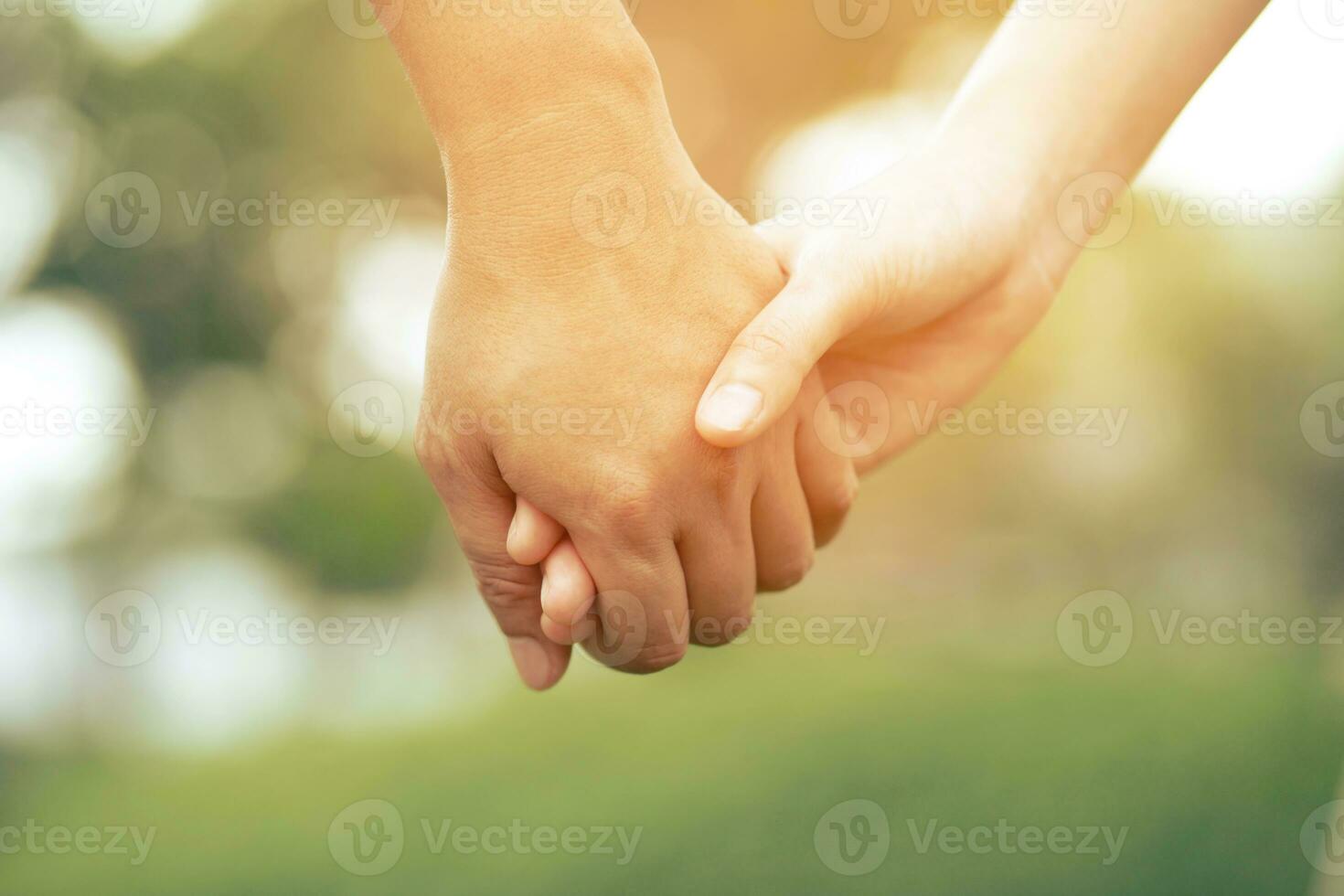 Woman and man holding hands, Happy couple love in the garden. concept couple lover valentine day photo