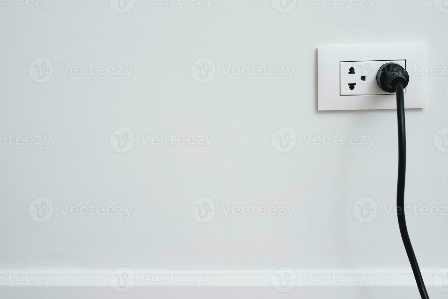 Close Up the electrical power socket and plug socket on wall. photo