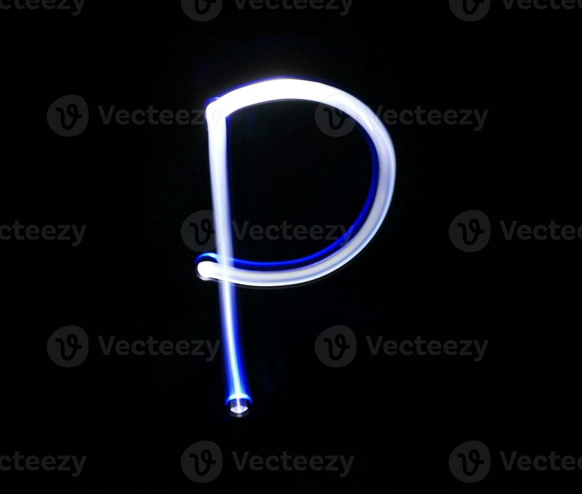 P Papa alphabet hand writing blue light  over black background. photo