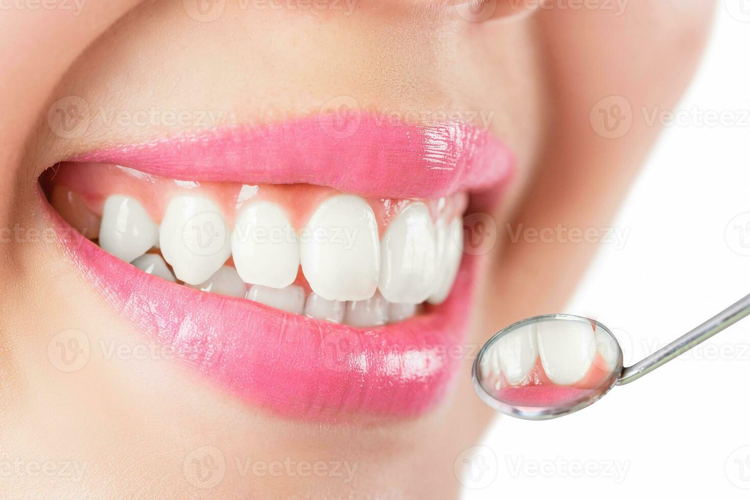 Close up young woman smiling white glamour teeth. photo