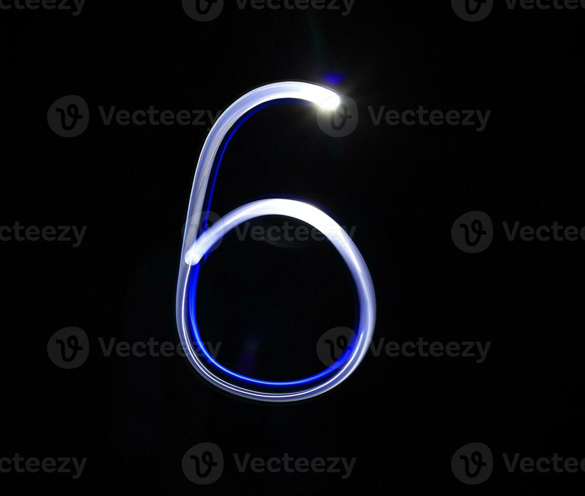 Six blue light digit hand writing over black background. photo