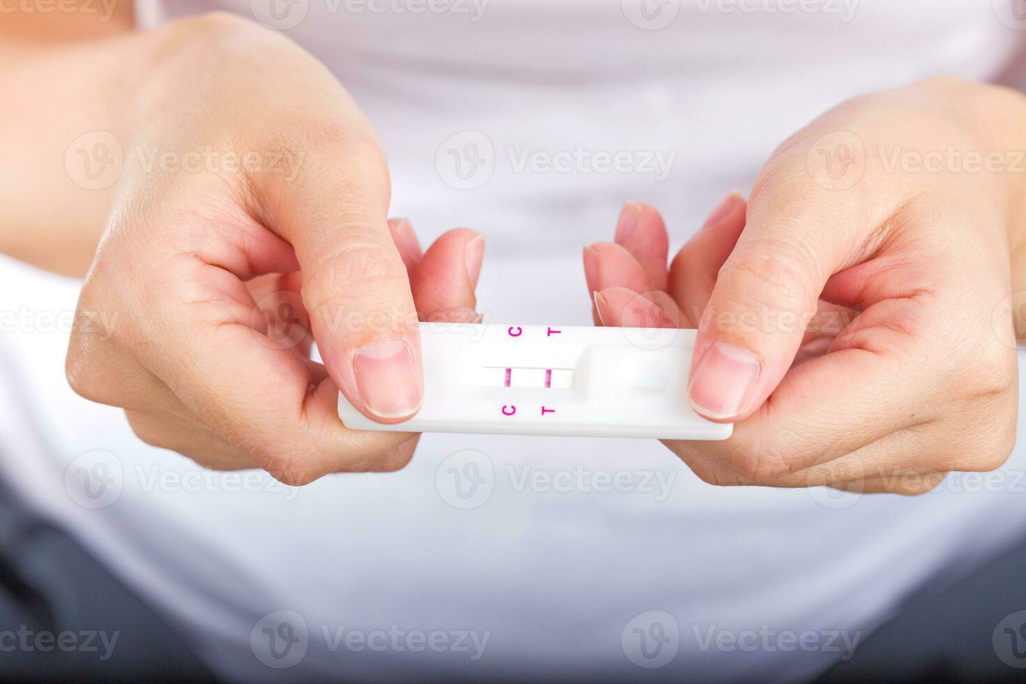 Young women checking pregnancy test. photo