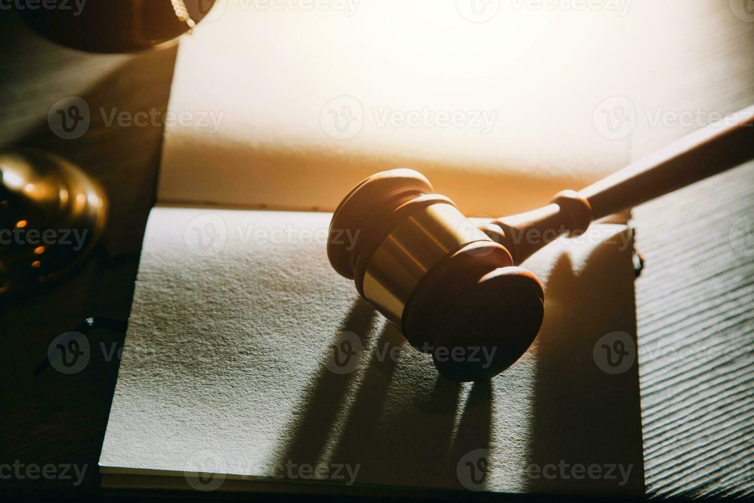 Business and lawyers discussing contract papers with brass scale on desk in office. Law, legal services, advice, justice and law concept picture with film grain effect photo