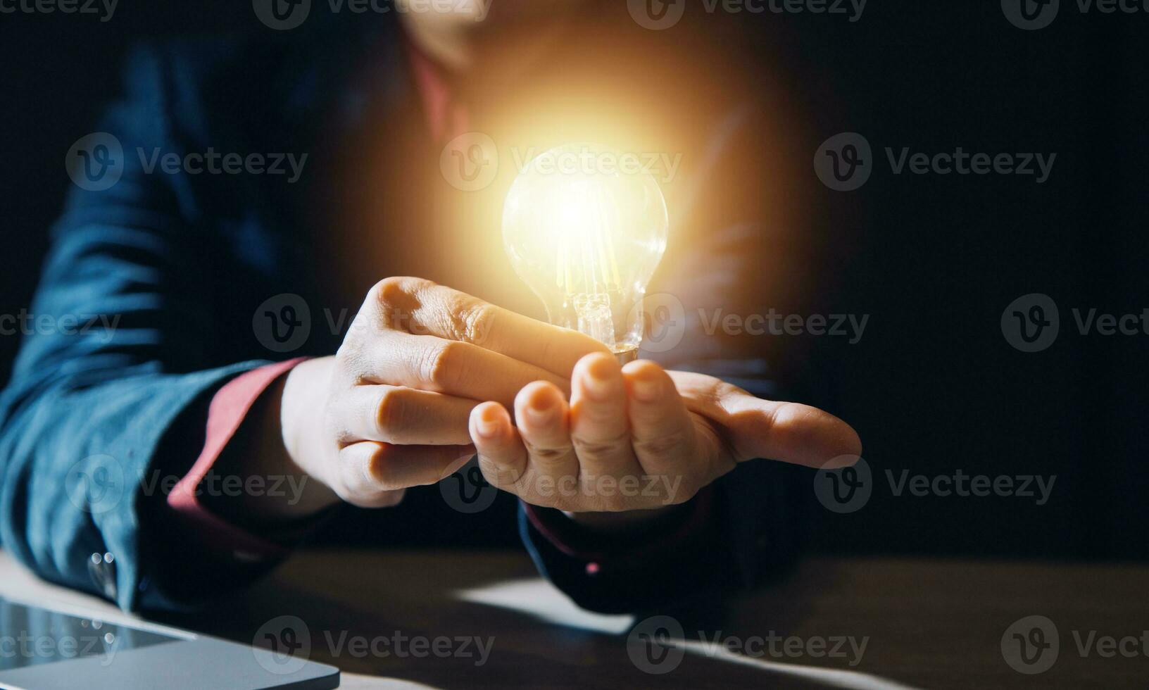 Creative new idea. Innovation, brainstorming, inspiration and solution concepts. The man is holding light bulb. Copy space background. photo