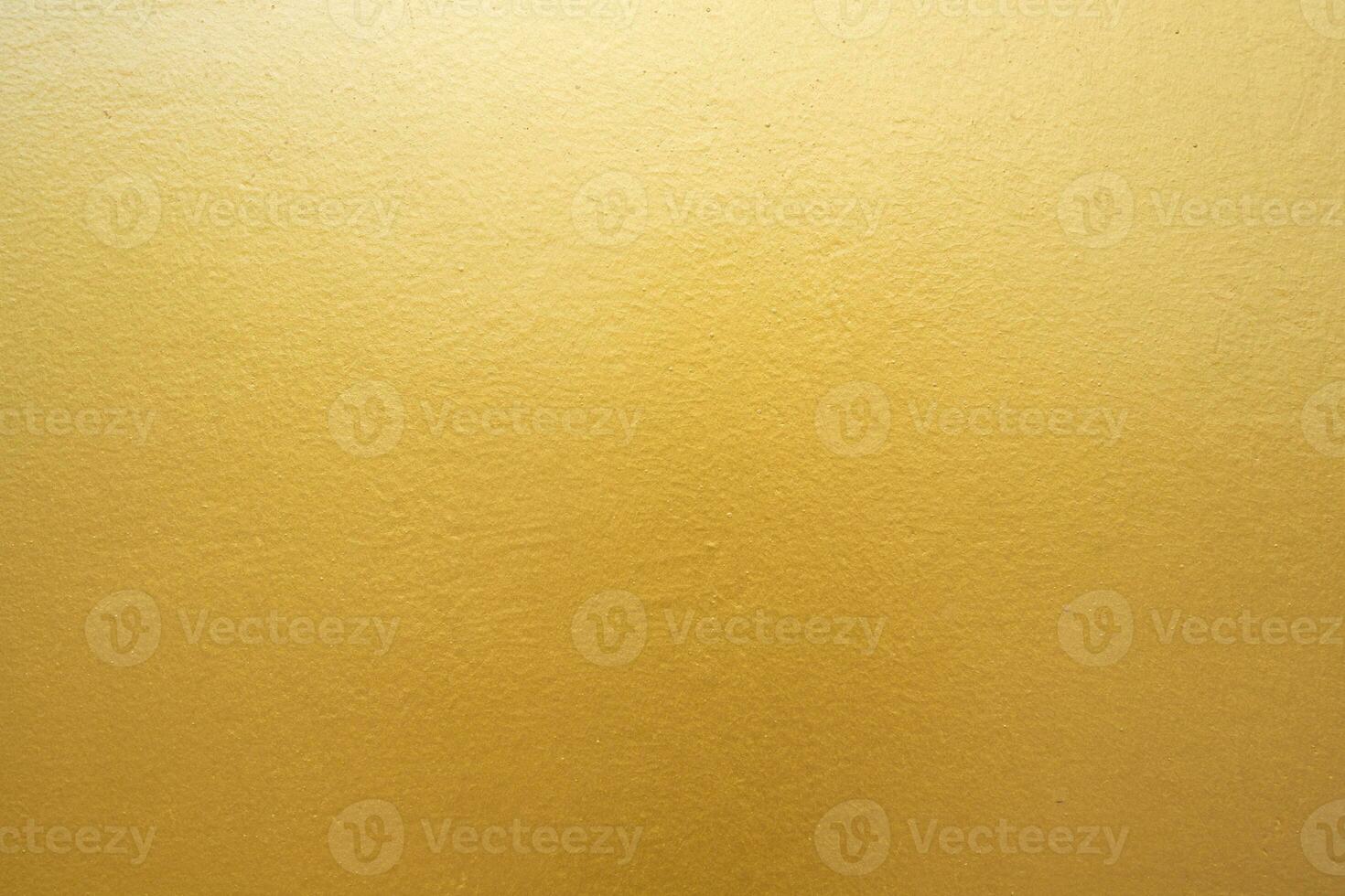 Gold concrete wall on background texture. photo