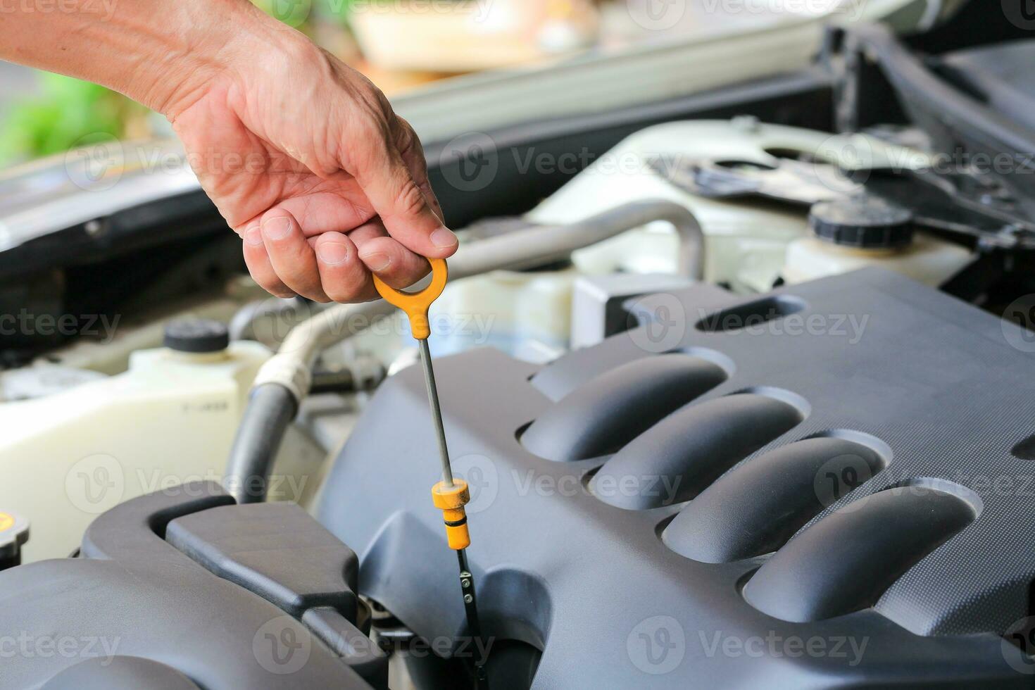 Close-up checking oil machine on a car. photo