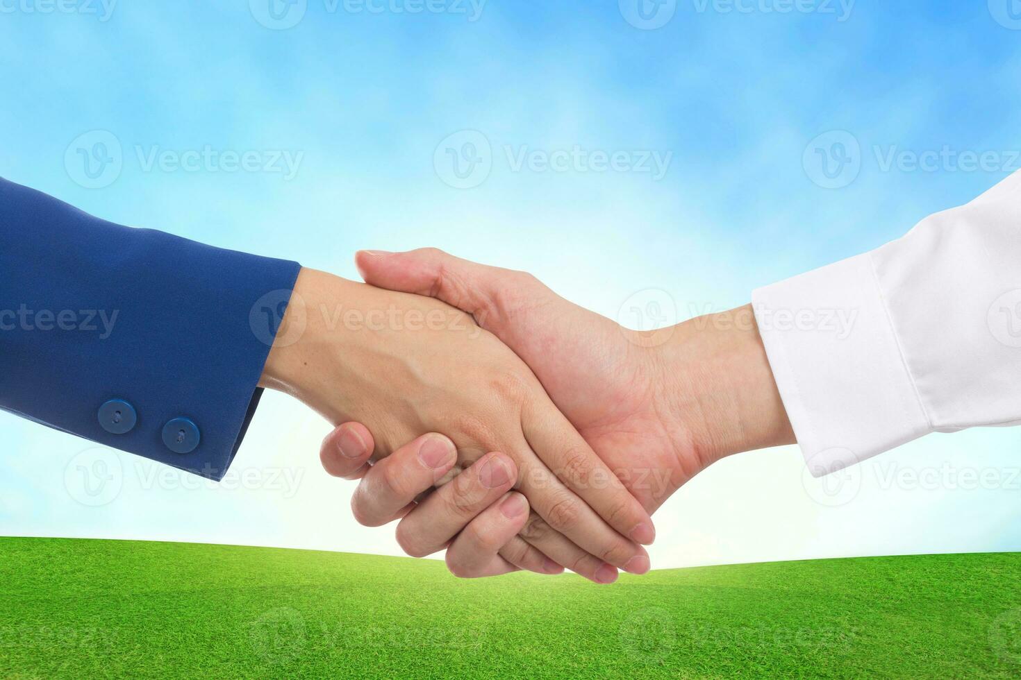 Handshake communication on landscape view background. photo