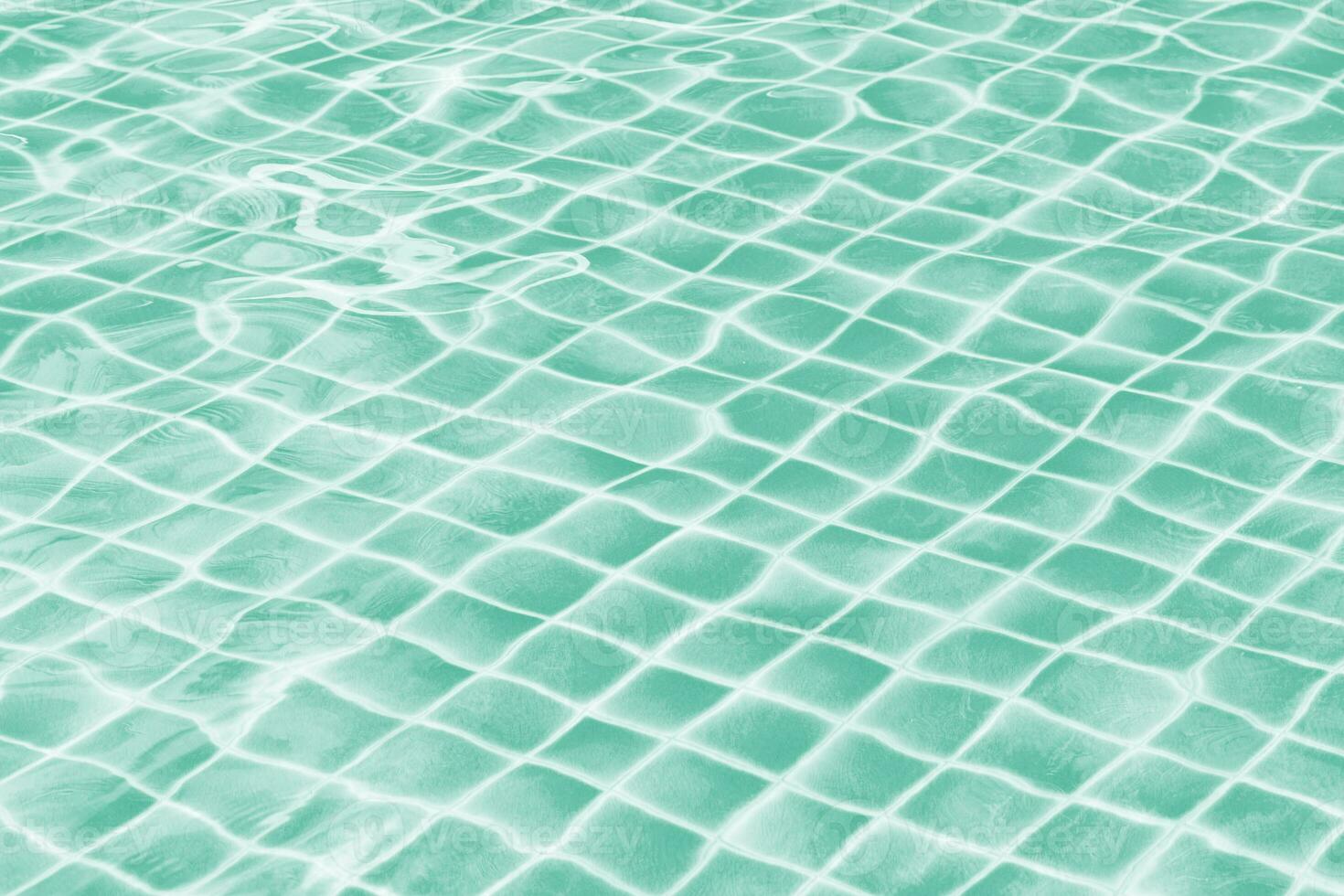 Light green jade swimming pool water texture reflection. photo