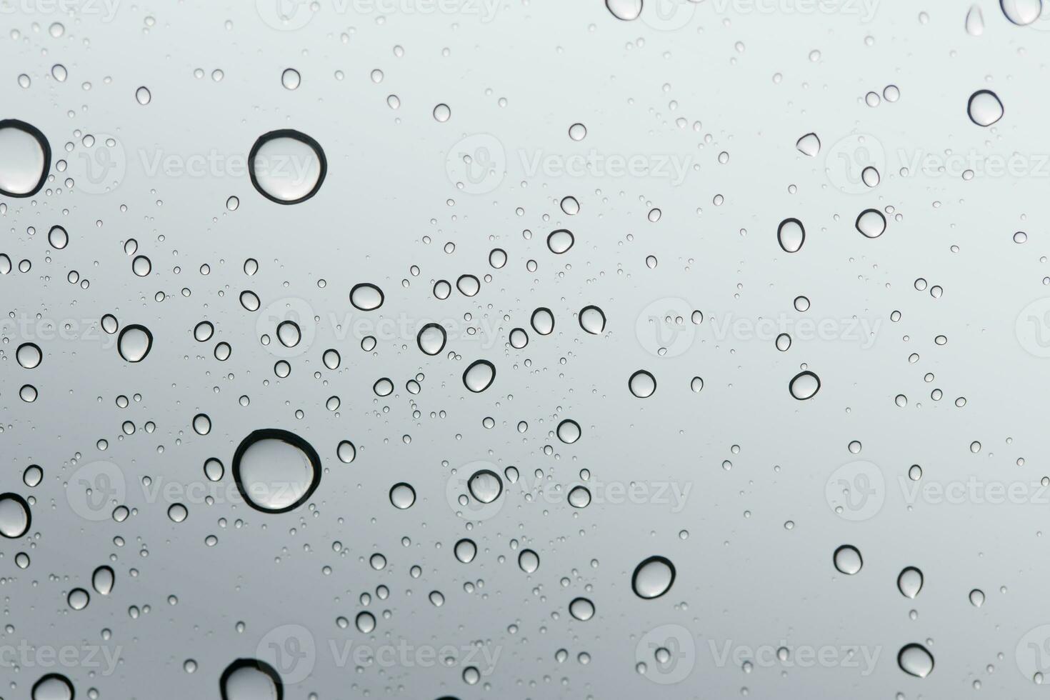 Water drop on glass mirror background, windshield photo