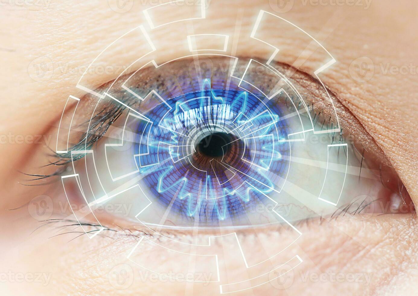 Close-up of woman's blue eye. High Technologies in the futuristic. contact lens photo