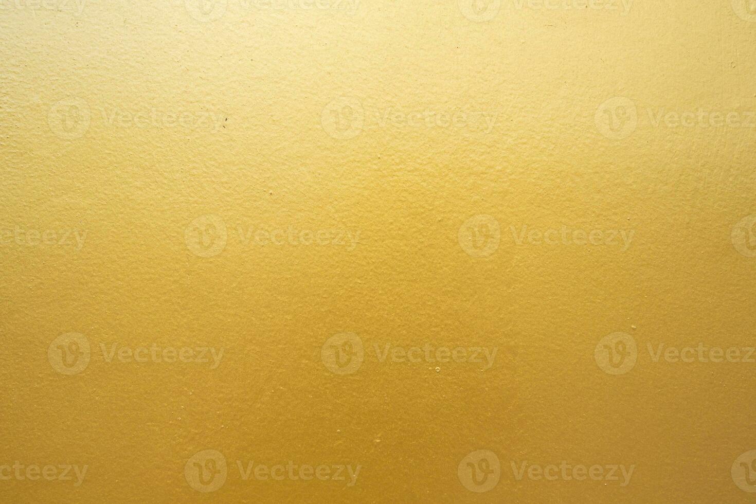 Gold concrete wall on background texture. photo