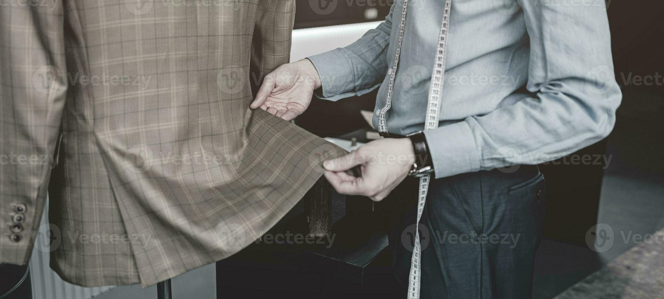 male tailor working in sudio photo