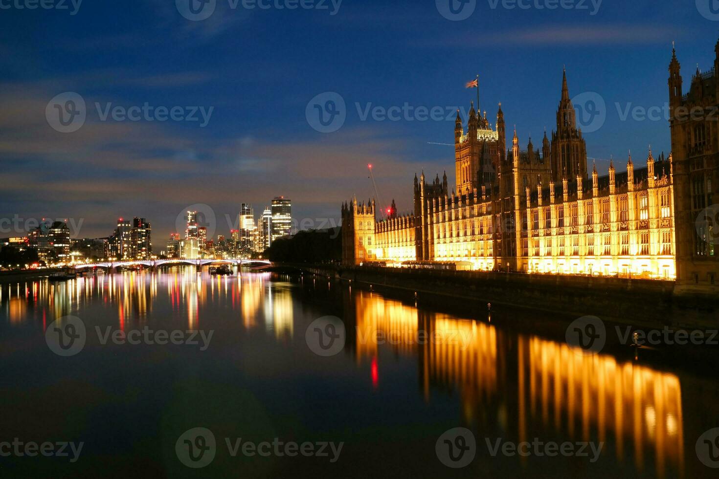 Beautiful Footage of Illuminated River Thames at London eye from Westminster, Big Ben clock Tower at After Sunset Night. England Great Britain,  Footage Was Captured on Aug 02nd, 2023 photo