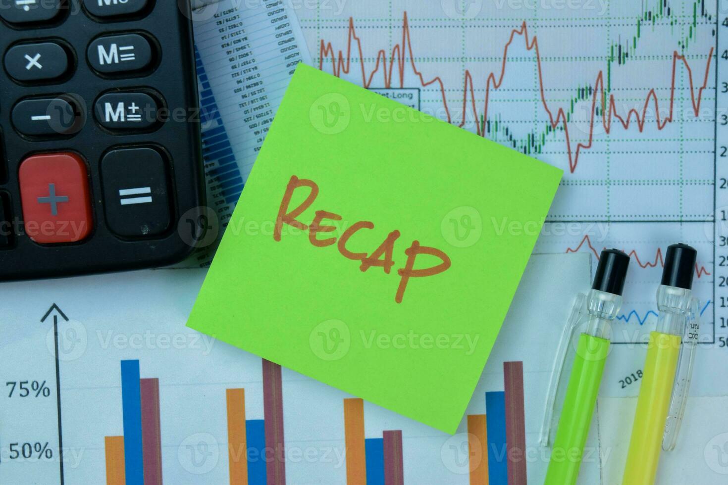 Concept of Recap write on sticky notes isolated on Wooden Table. photo