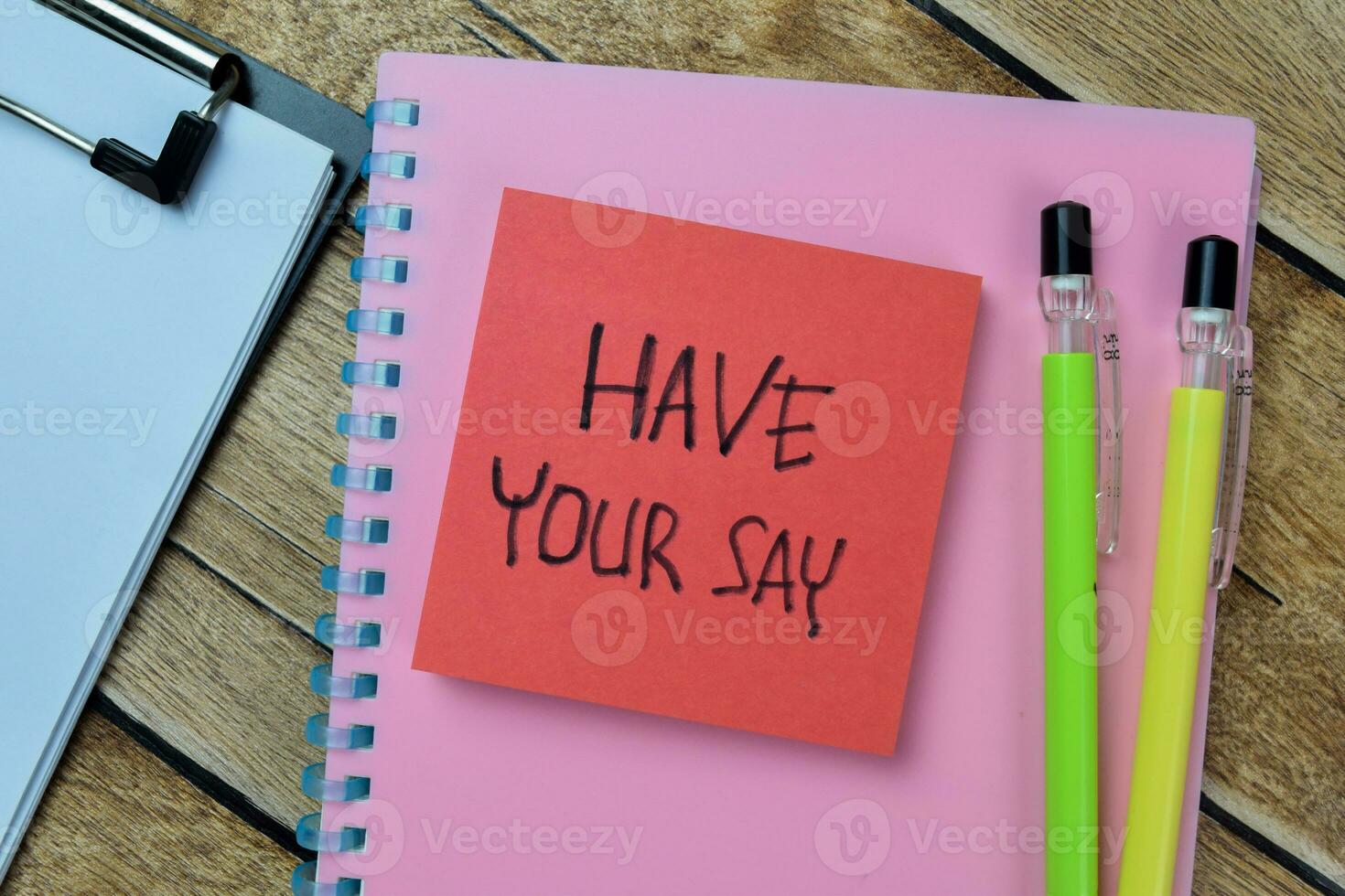 Concept of Have Your Say write on sticky notes isolated on Wooden Table. photo