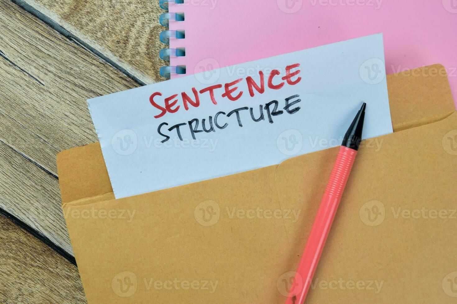Sentence Structure text with document brown envelope isolated on office desk photo