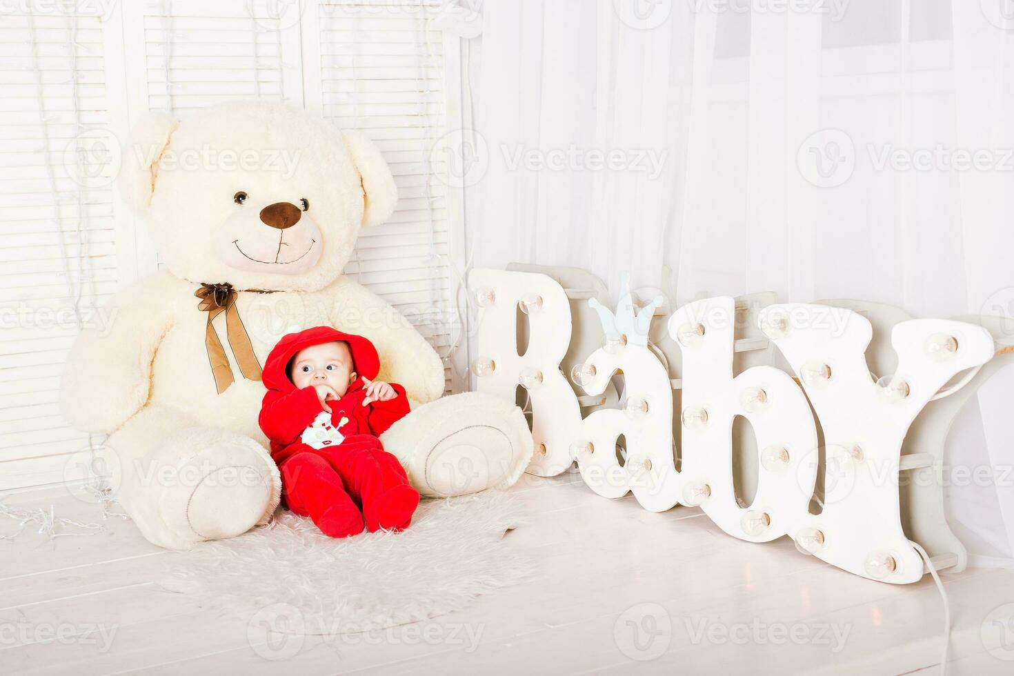 Baby with teddy bear. Christmas holiday concept photo