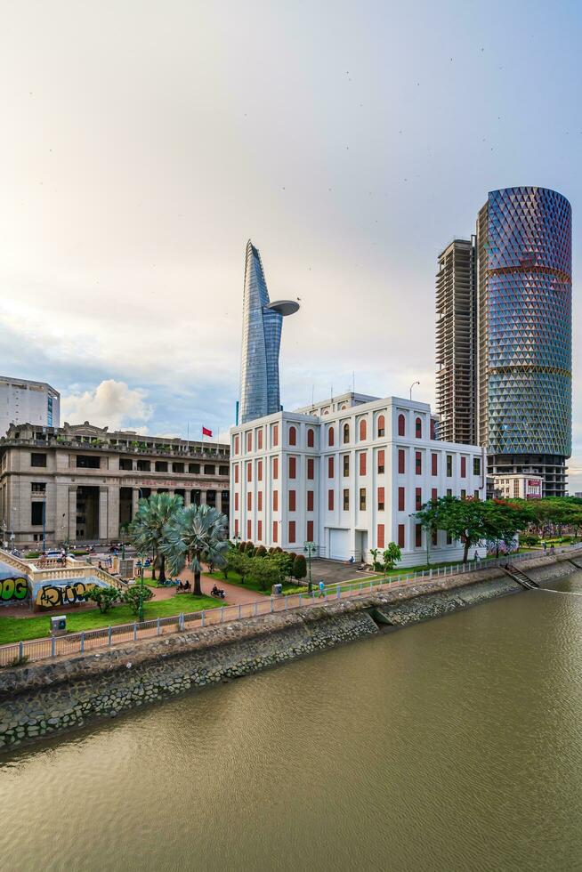 Ho Chi Minh, Viet Nam - 11 June 2023 Evening at District 4, see the Bitexco Tower and IFC One Tower, two of the beautiful office building in Ho Chi Minh city photo