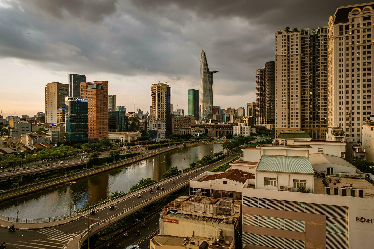 Ho Chi Minh, Viet Nam - 22 June 2023 Aerial view of Bitexco Tower, buildings, roads and Saigon river in Ho Chi Minh city photo