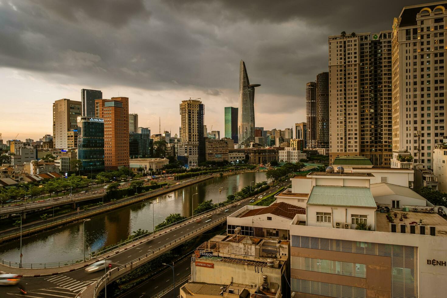 Ho Chi Minh, Viet Nam - 22 June 2023 Aerial view of Bitexco Tower, buildings, roads and Saigon river in Ho Chi Minh city photo