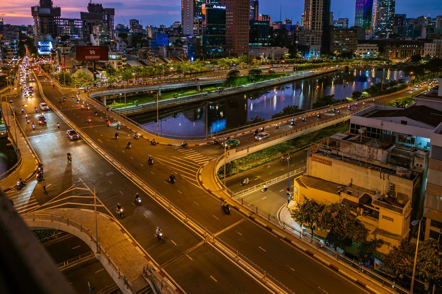 Ho Chi Minh, Viet Nam - 22 June 2023 Aerial view of Bitexco Tower, buildings, roads and Saigon river in Ho Chi Minh city photo
