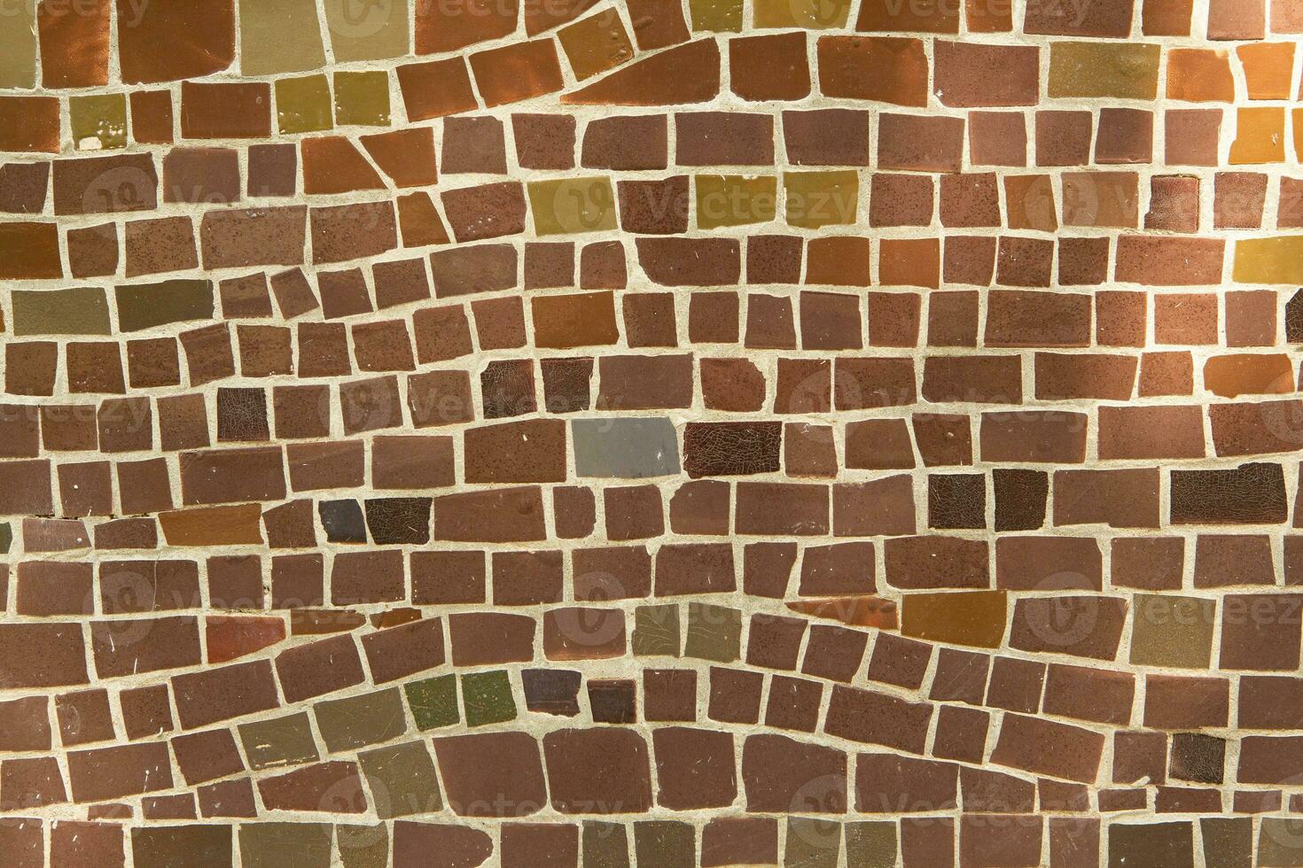 Colorful ceramic mosaic on the walls of the building. Abstract background and texture for design. photo
