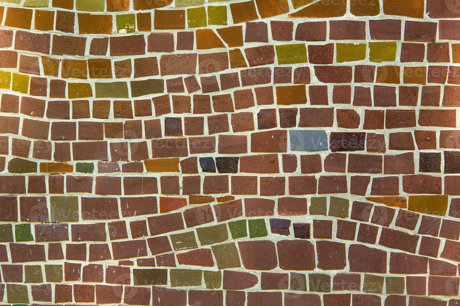 Colorful ceramic mosaic on the walls of the building. Abstract background and texture for design. photo