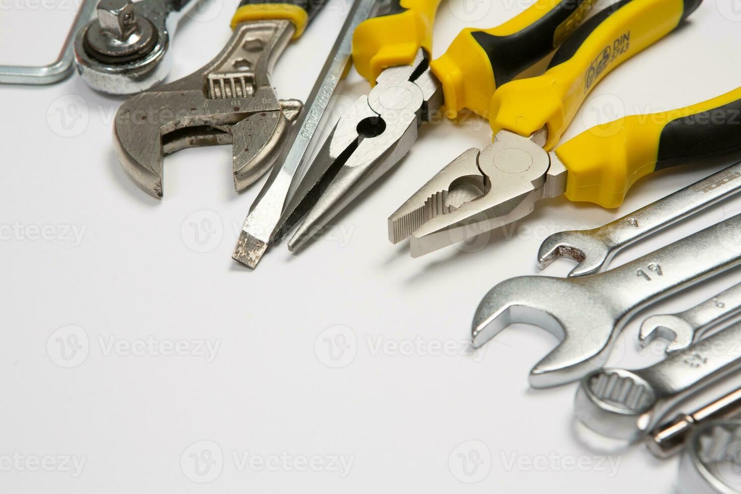 Set of tools for repair in a case on a white background. Assorted work or construction tools. Wrenches, Pliers, screwdriver. Top view photo