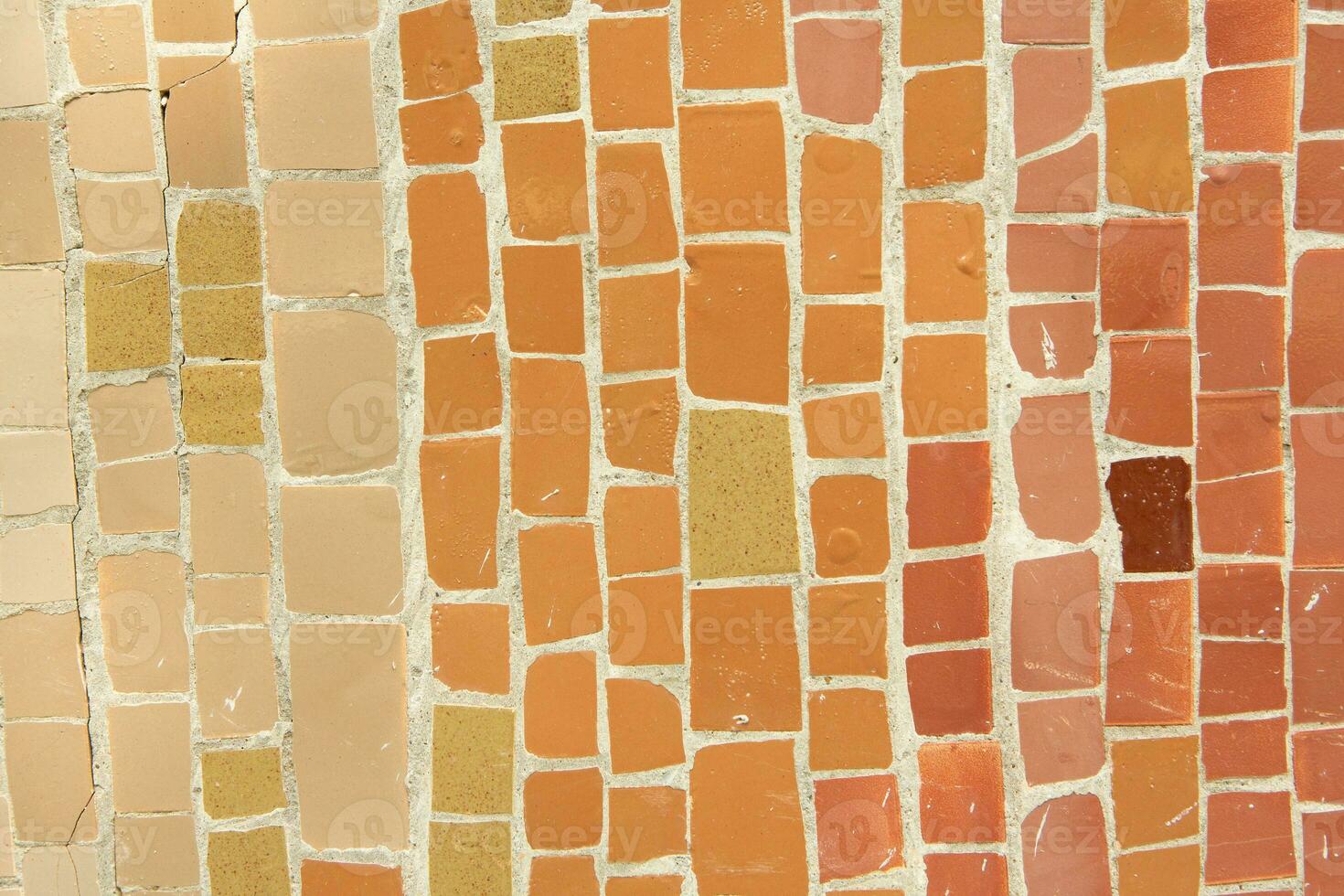 Colorful ceramic mosaic on the walls of the building. Abstract background and texture for design. photo
