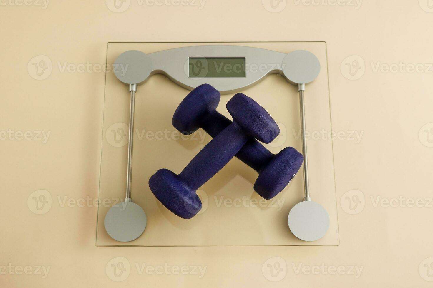 dumbbells on floor scales, weight loss workout at home photo