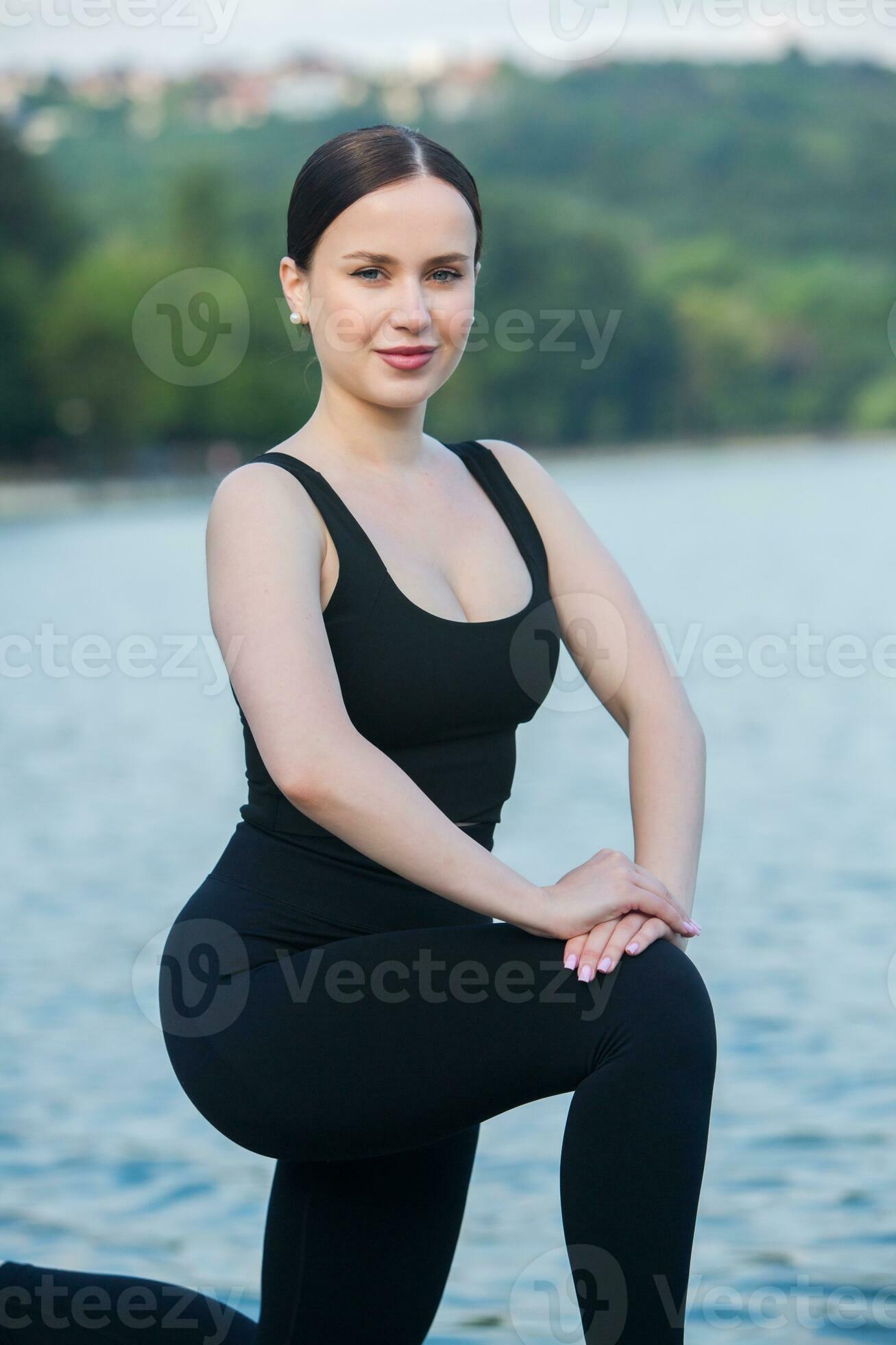 Serious Beautiful Female in Sportswear Doing Exercise Outdoors