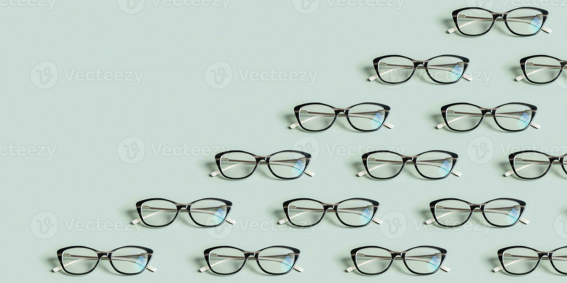 Glasses for vision on a green background with copy space. Optical store, vision test, stylish glasses concept. Banner photo