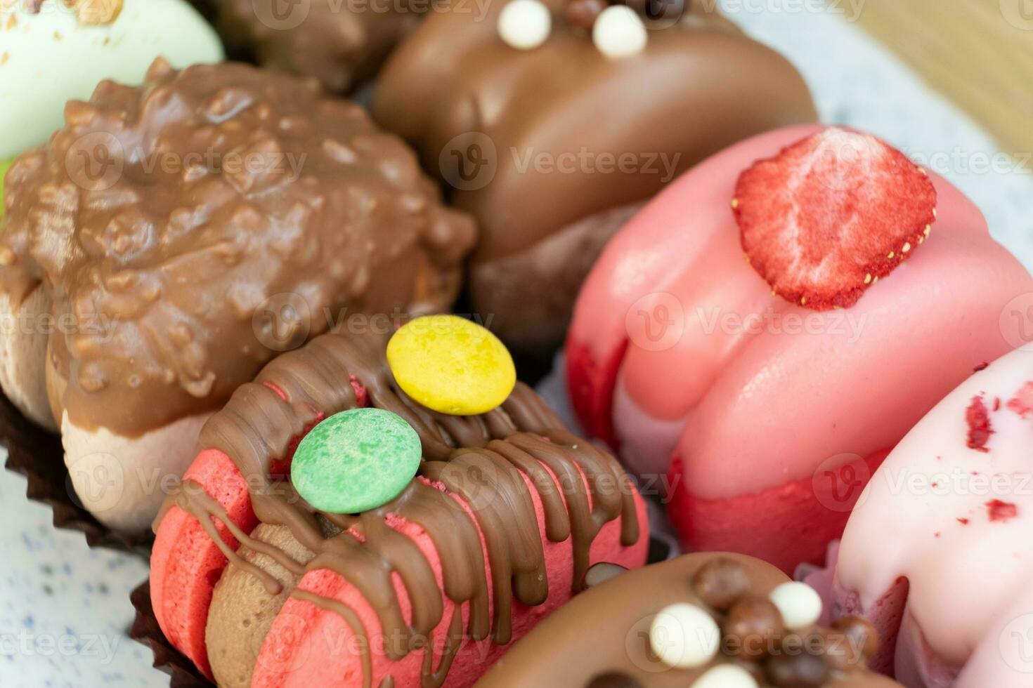 Colored macaroons with decoration for those with a sweet tooth close up. photo