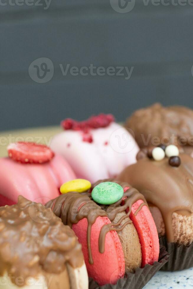 Colored macaroons with decoration for those with a sweet tooth close up. photo