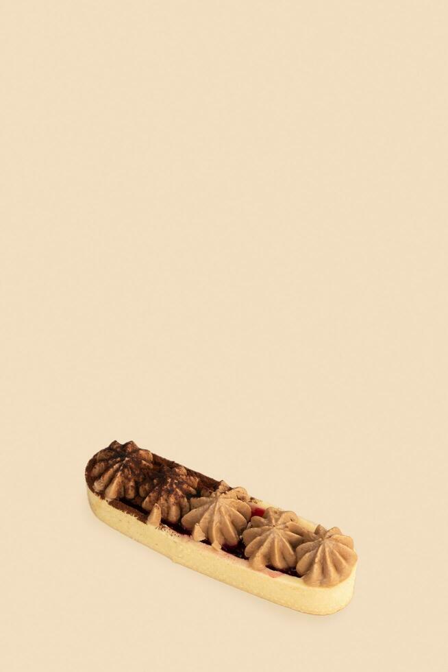 Cake with shortcrust pastry and cream pattern on beige background photo
