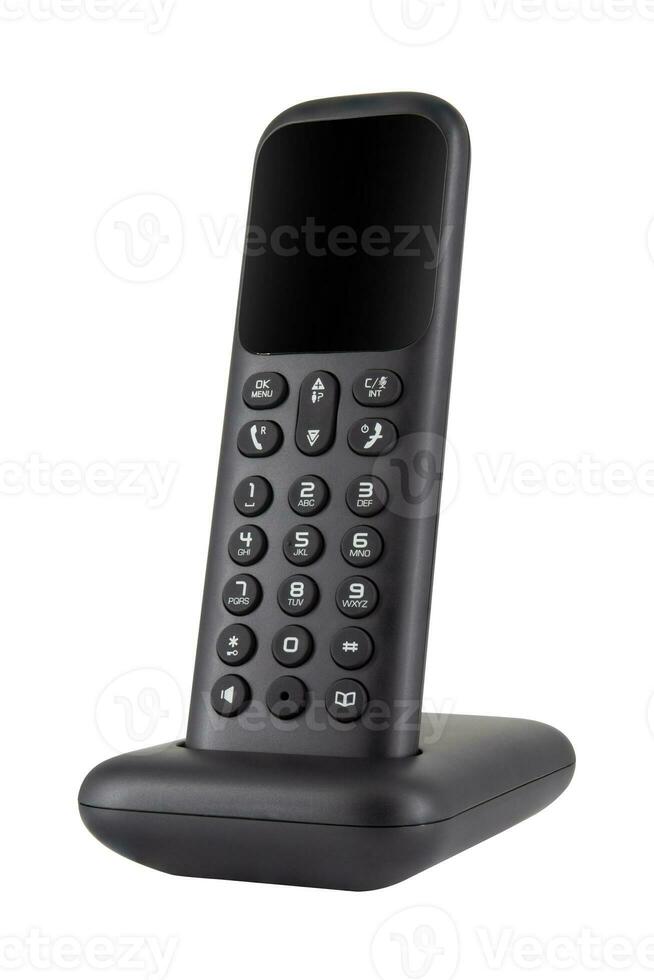 Black cordless phone with charging station isolated on white background photo