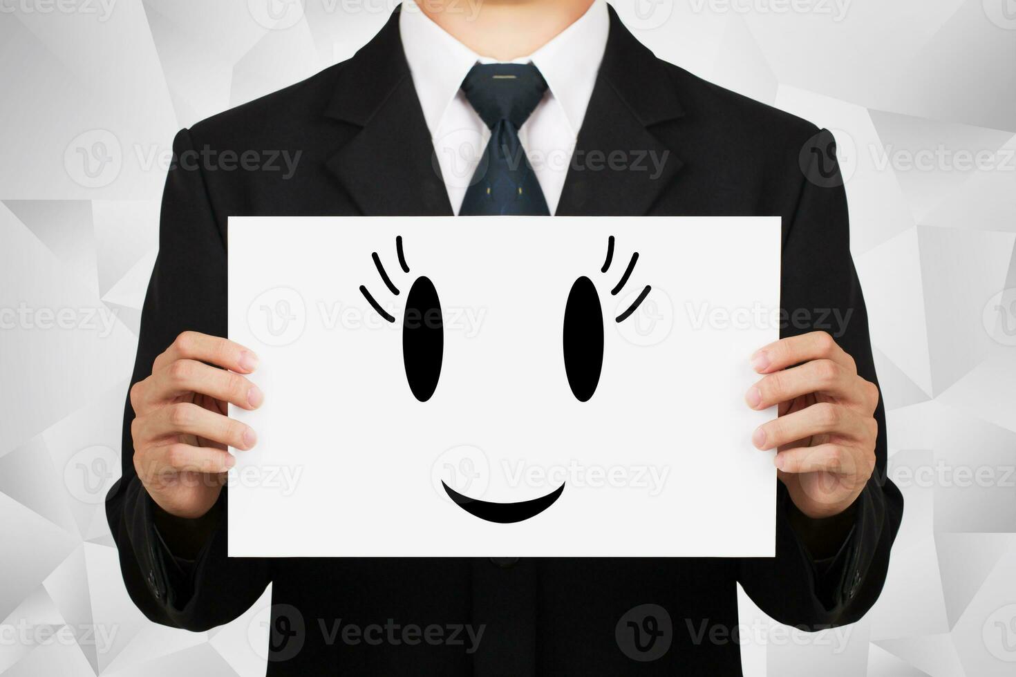 Businessman holding on whiteboard with icon smile. photo