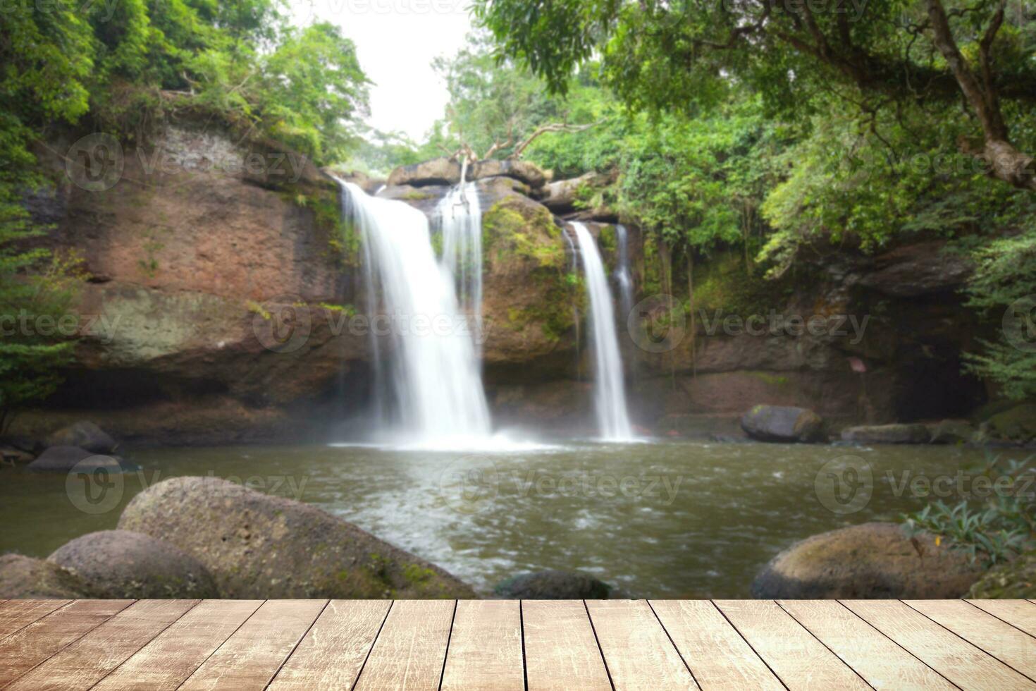 Wooden table with environmental in water fall  forest. photo