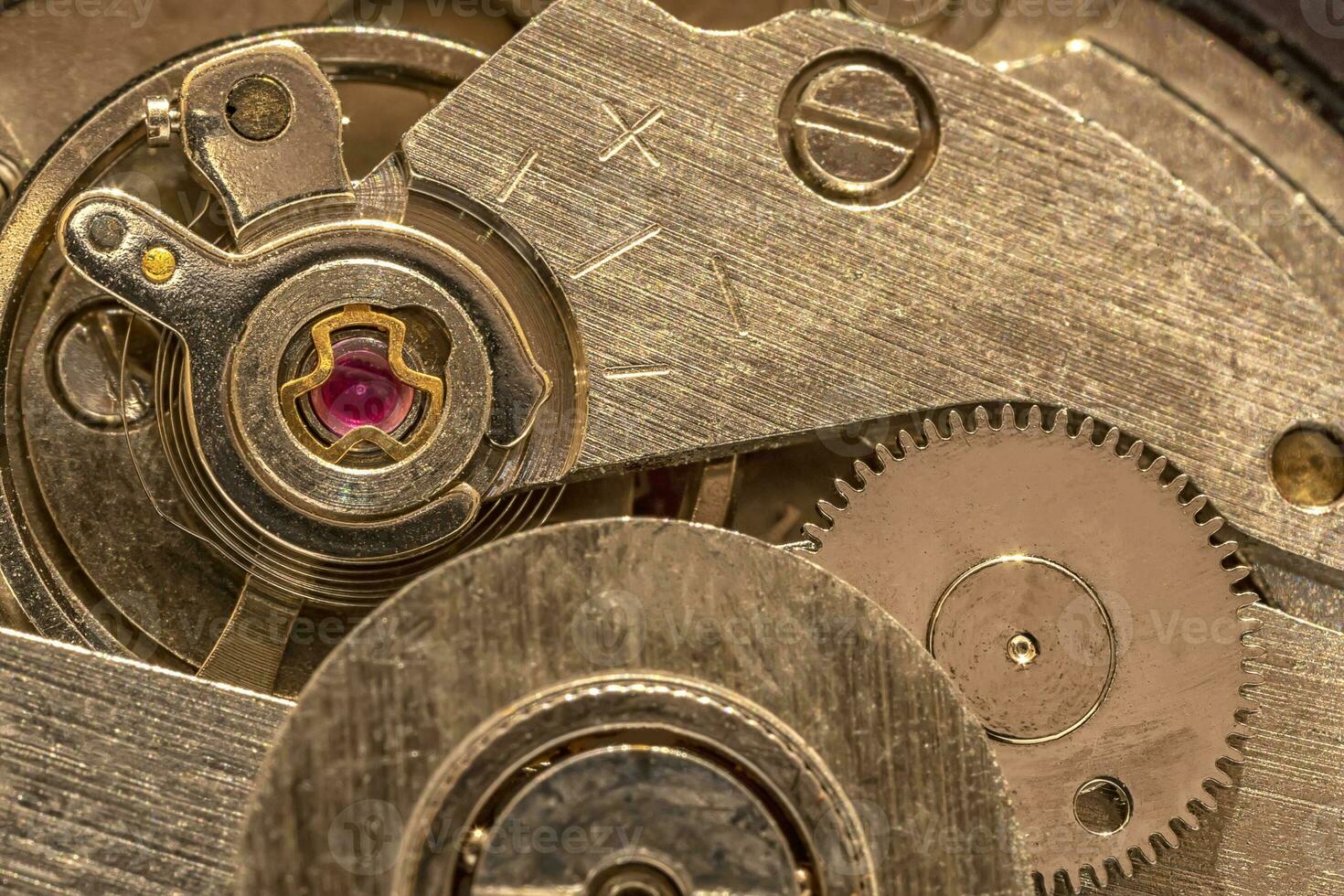 Macro shot of clockwork gears inside the watch photo