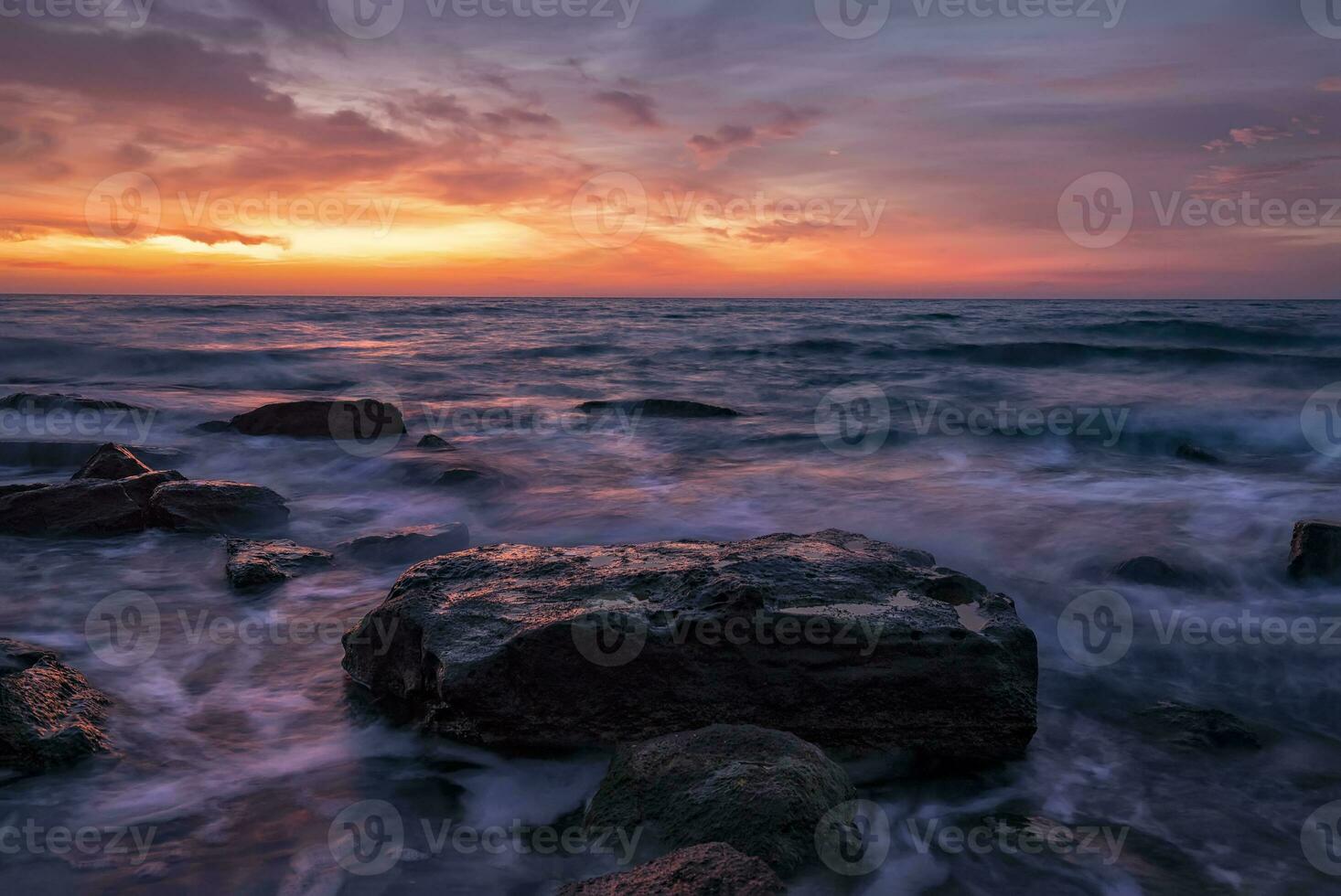 Seascape with rocks during sunrise. Stunning natural seascape. Sea sunrise at the Black Sea coast. photo