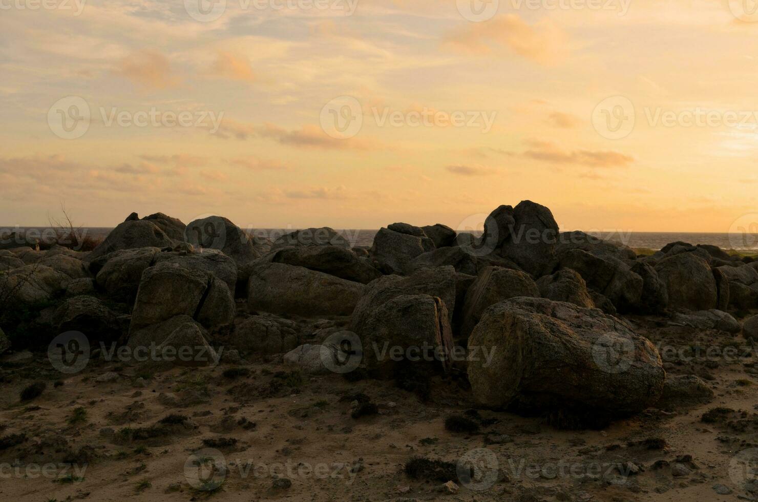Golden Hour with Rocks on the Beach in Aruba photo