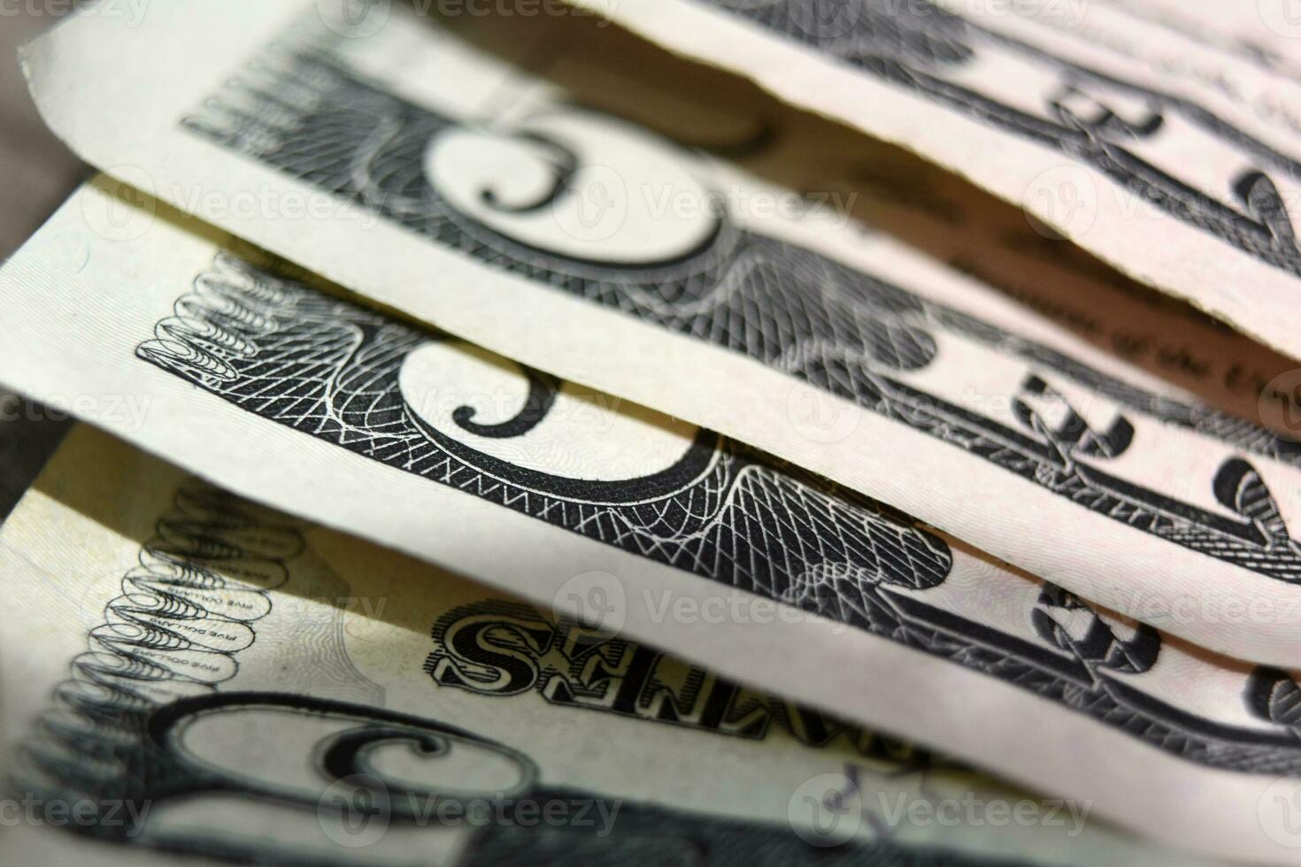 Five Dollar Bills Up Close and Spread Out photo